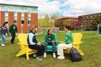 Students relax on Marywood University's campus on colorful Adirondack chairs. Marywood was just named as the Best Value among all Northeast PA colleges by U.S. News and World Report. Marywood’s Quality and Value Recognized by “Best Colleges”